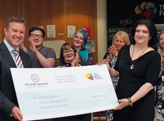 Quilter Cheviot deliver a generous donation to The Brain Charity's dementia project