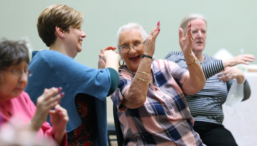 Care home residents participate in a Music Makes Us! SALT through singing class from The Brain Charity in Liverpool