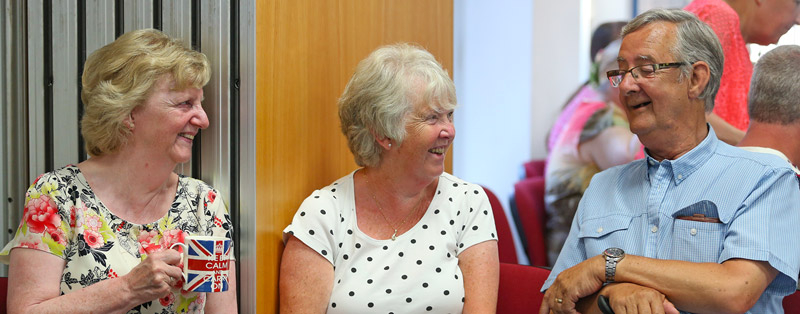 Friends and carers socialising at The Brain Charity
