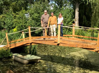 Fundraiser Steve with the sponsored bridge he built