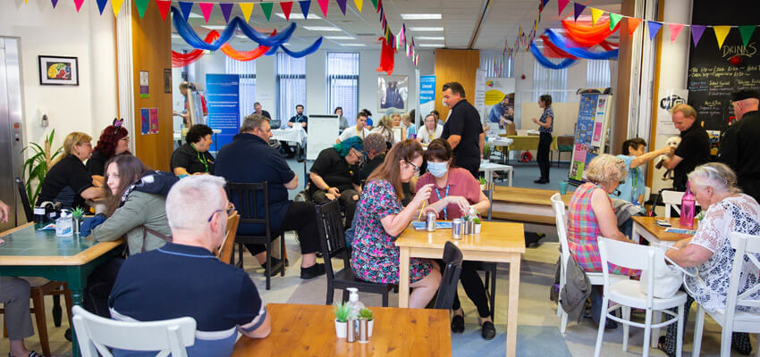 Socialising at The Brain Charity's cafe in Liverpool