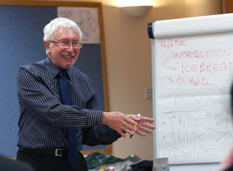 Leading a session in a meeting room at The Brain Charity