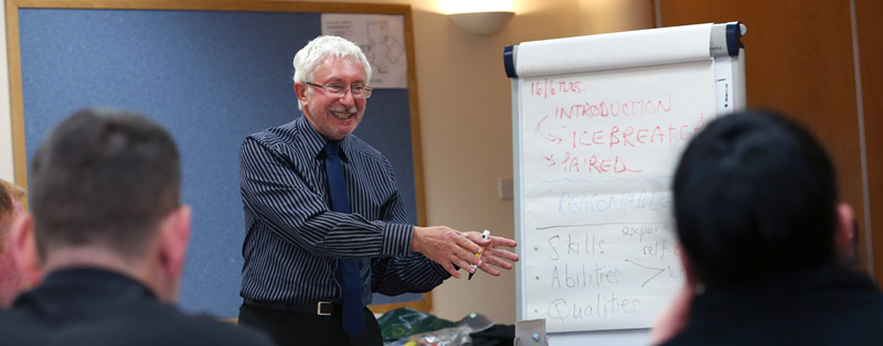 Leading a session in a meeting room at The Brain Charity