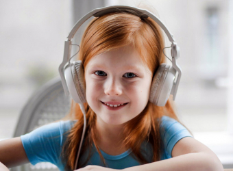 A child wearing a headset