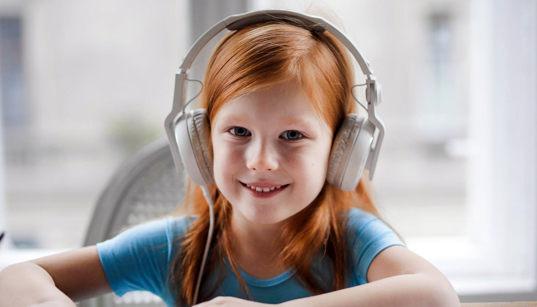 A child wearing a headset