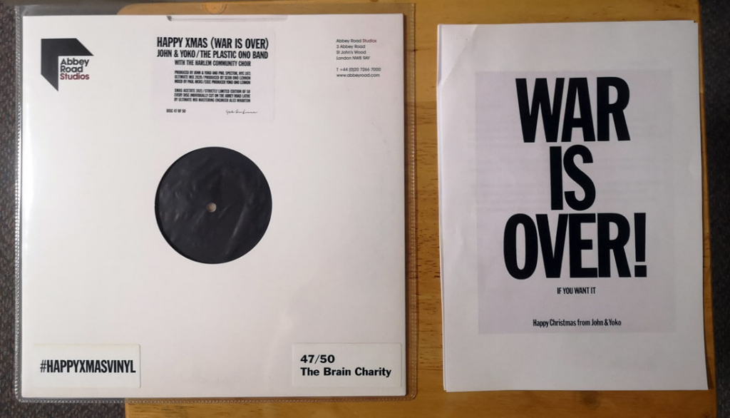 Close up of the limited edition acetate of the John Lennon Yoko Ono single ‘Happy Xmas (War is Over) that has been donated to The Brain Charity