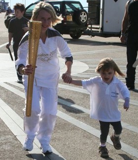 Lisa and Angelina carrying the Olympic torch