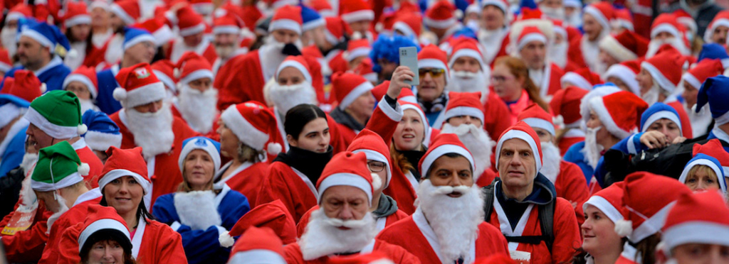 Hundreds of people dressed as Father Christmas take part in the Santa Dash