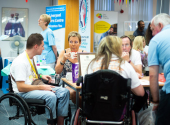 People enjying a meeting at The Brain Charity