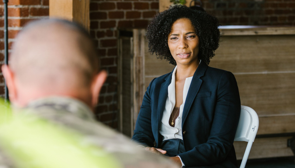 A female counsellor talks to a man