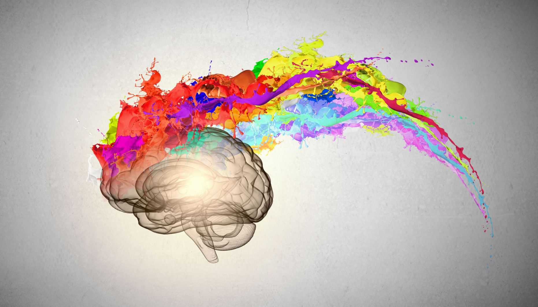 Creative pinmting of brain with colourful paint splashes