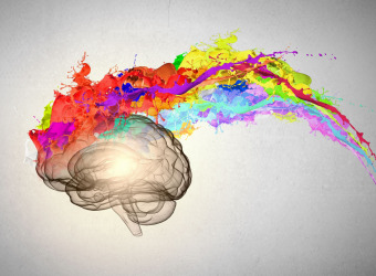 Creative pinmting of brain with colourful paint splashes