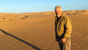 Guy Deacon standing in the African desert