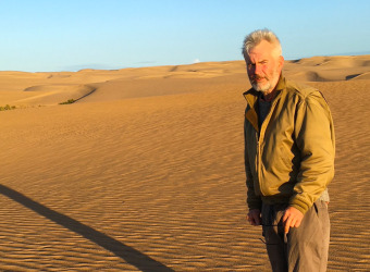 Guy Deacon standing in the African desert