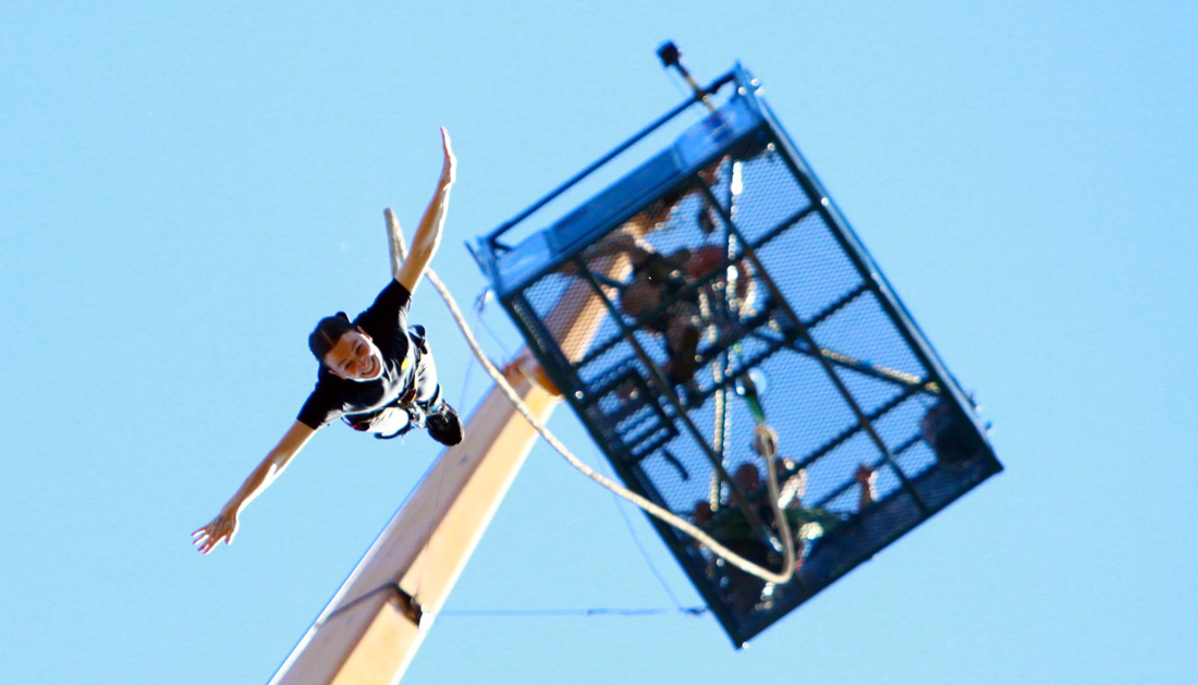 Fundraiser Gemma bungee jumps from a tall platform