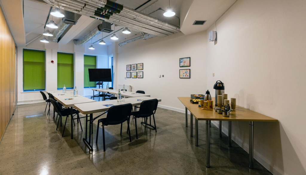 Lounge meeting room at The Brain Charity in U-shaped layout