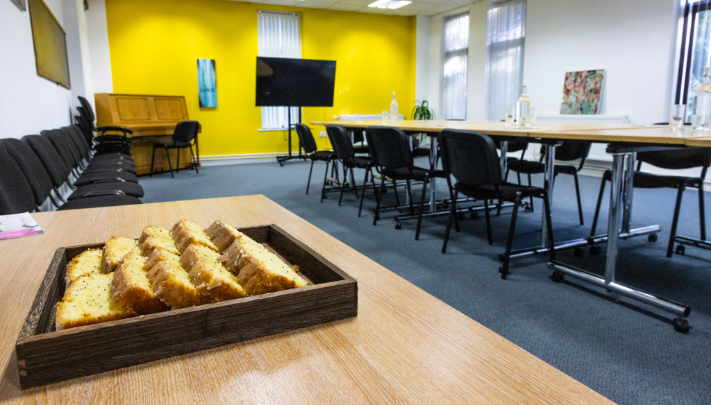 Meeting room at The Brain Charity in Liverpool - boardroom layout with food