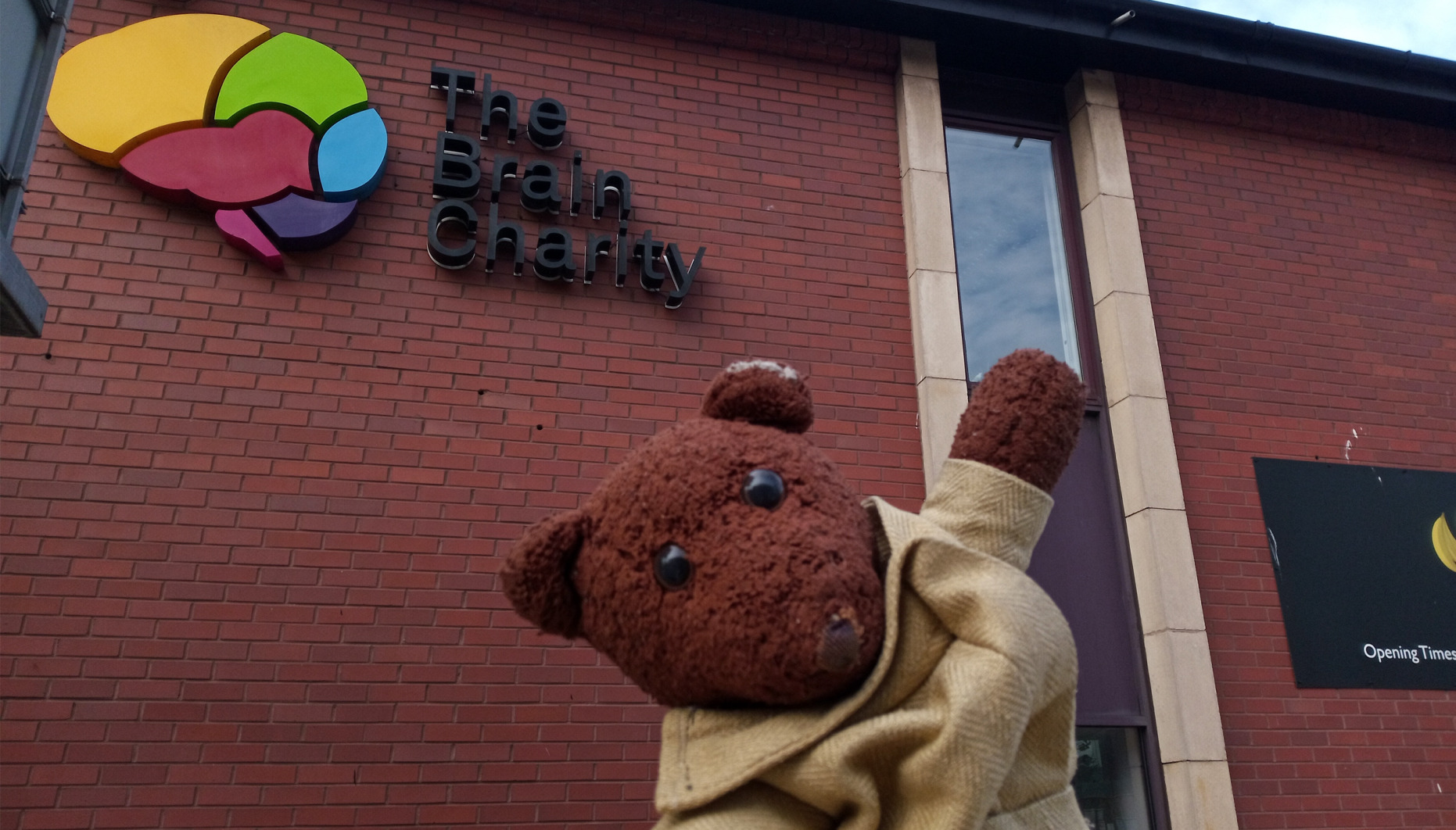 Famous teddy bear Bearsac outside The Brain Charity