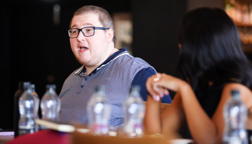 Young man enjoys a chat in The Brain Food café