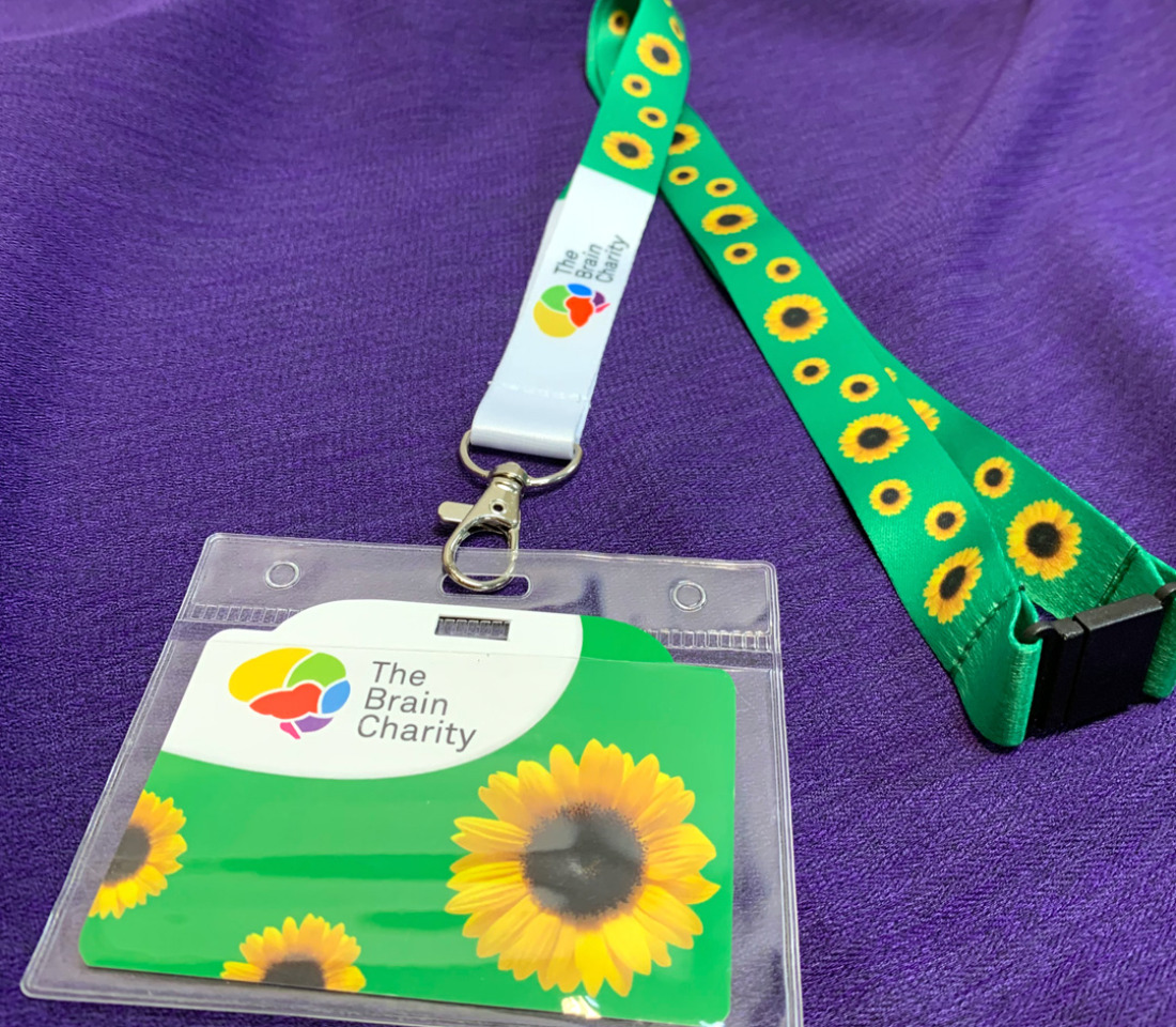 The Brain Charity's Hidden Disabilities Sunflower lanyard wiith cards and wallet.