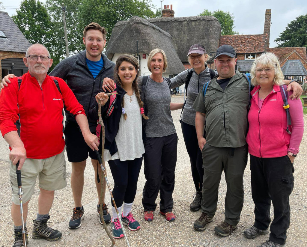 A mixed age group of hikers at the start of a walk