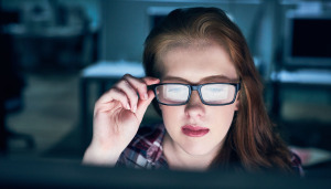 Woman concentrating on laptop screen