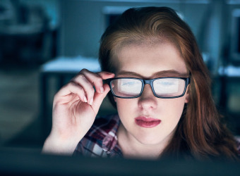 Woman concentrating on laptop screen