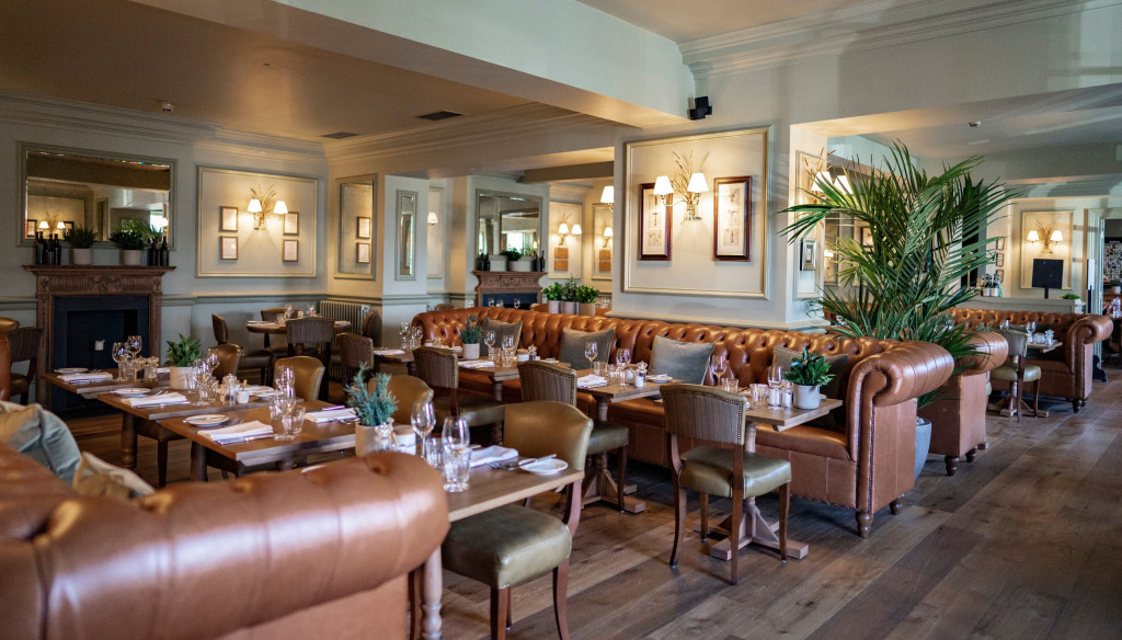 Bistro du Vin at Hotel du Vin Harrogate. A light, airy room with elegant leather sofas, tables and leather cushioned dining chairs.