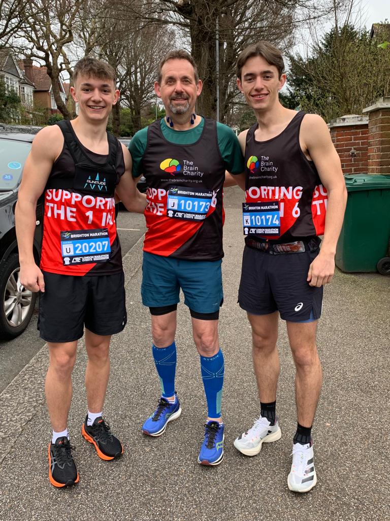 Tom Carpenter with
dad Graeme and brother Will in Brain Charity running shirts before the marathon