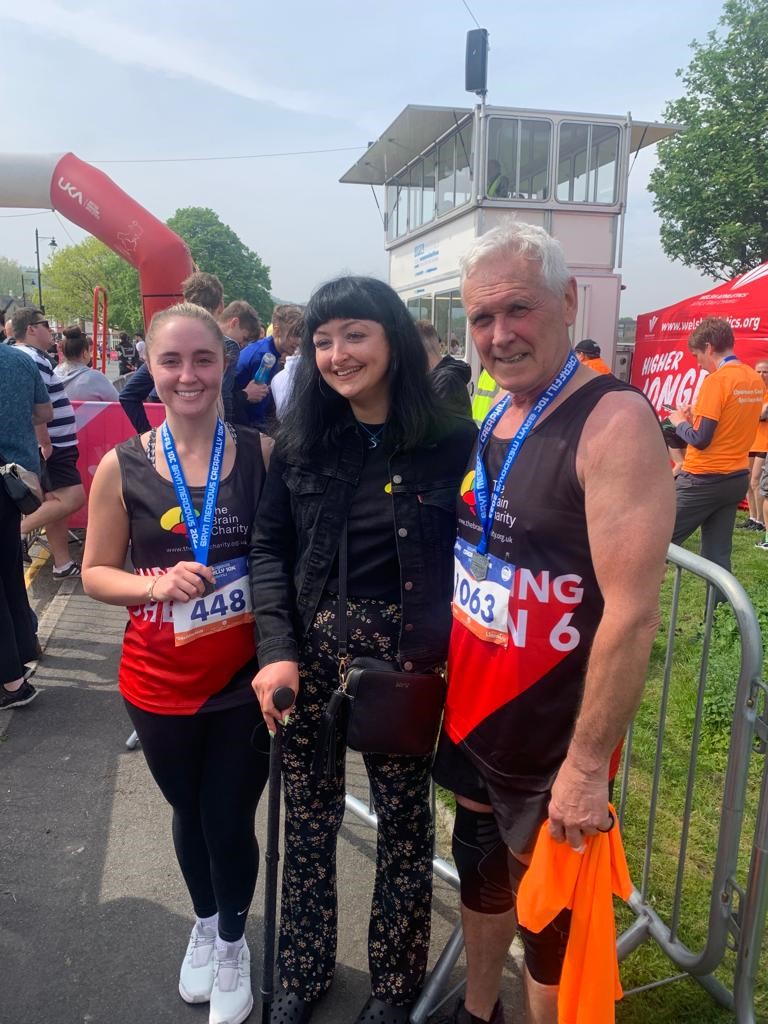 Viv Walker standing alongside Megan and her sister at the finish of the Caerphilly 10K