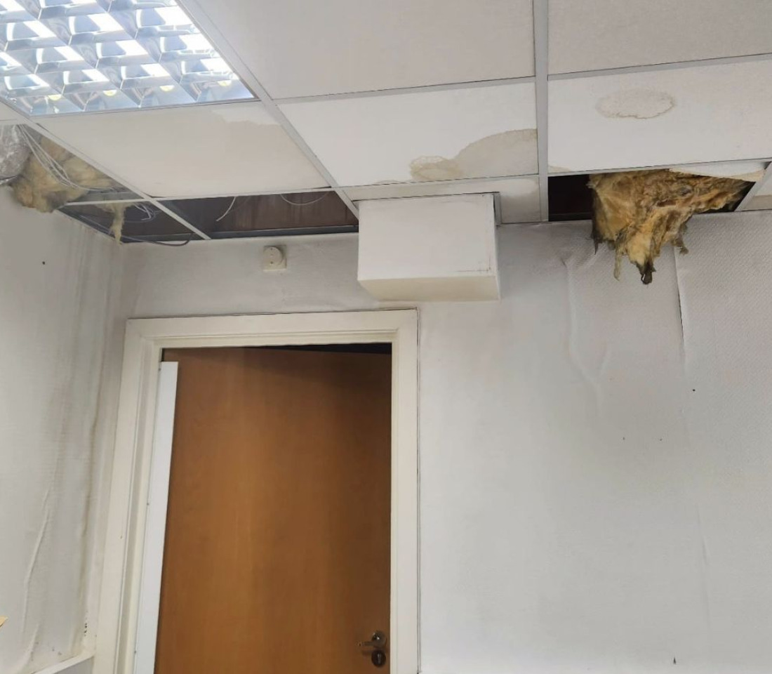 Rain damage to The Brain Charity offices caused by a collapsed ceiling from leaking roof