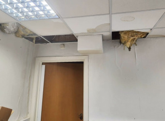 Rain damage to The Brain Charity offices caused by a collapsed ceiling from leaking roof