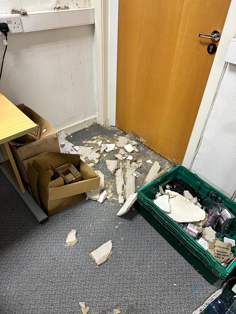 Rain damage to The Brain Charity offices caused by a collapsed ceiling from leaking roof