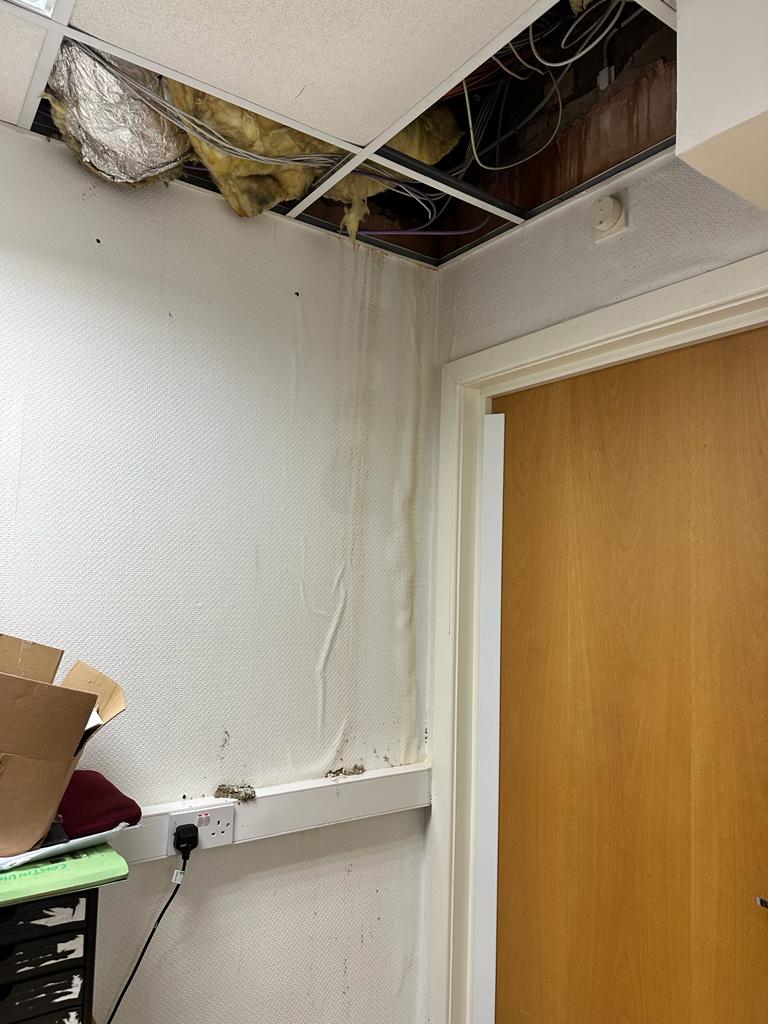 Collapsed office ceiling caused by rain damage