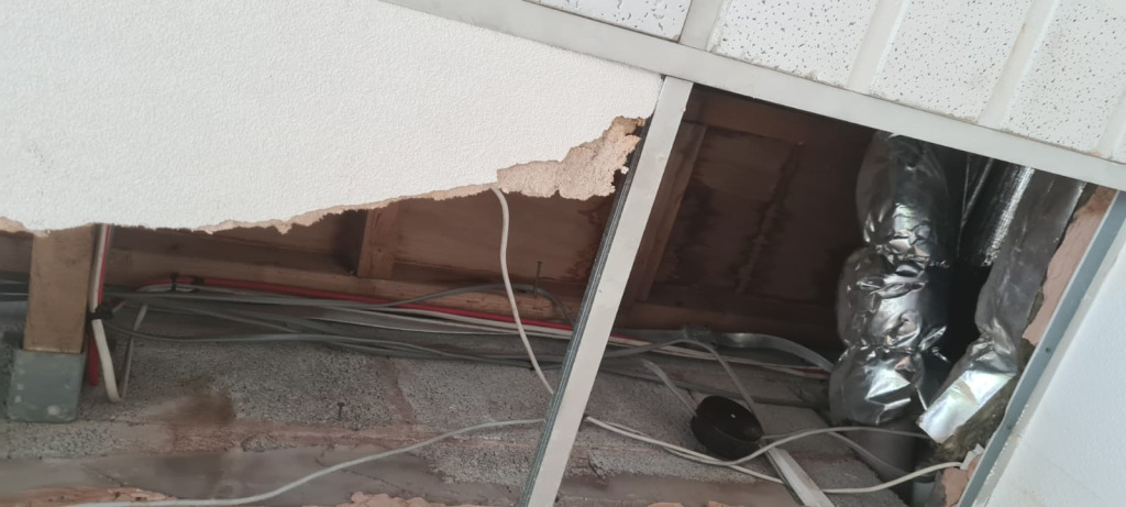 Rain damage to The Brain Charity offices caused by a collapsed ceiling from the leaking roof