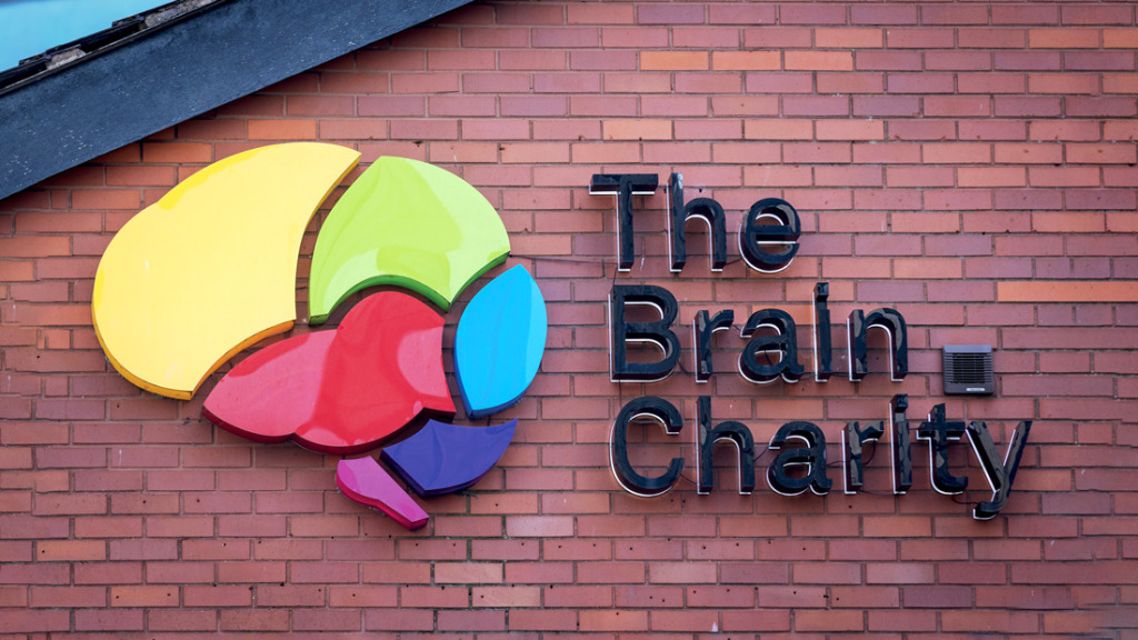 The Brain Charity logo on a wall in colourful plastic