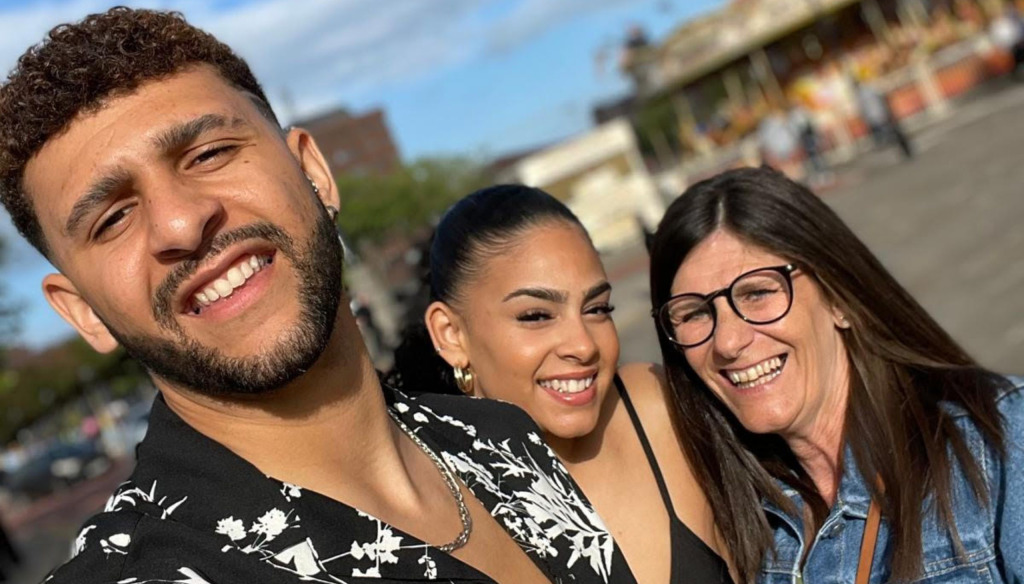 Theo Mayne with his mum and sister