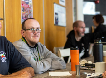 A group of friends meeting in The Brain Charity café