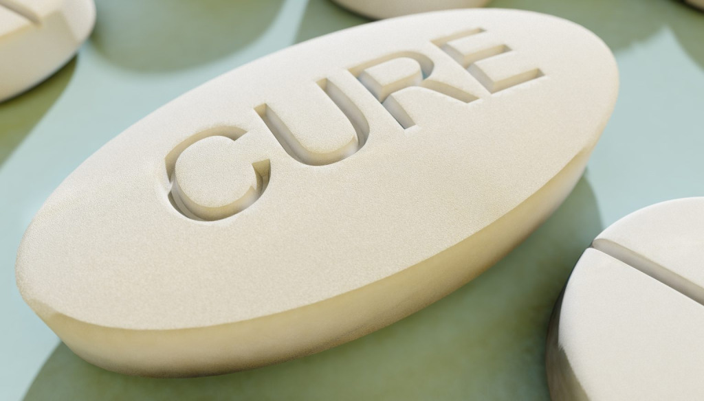 A medical tablet with the word cure impressed into it