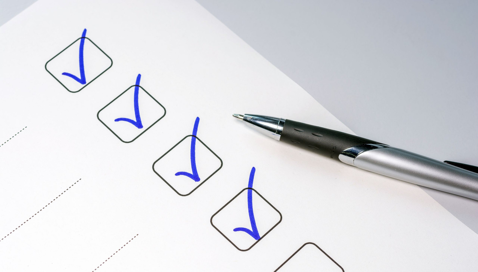 pen and paper with checklist