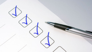 pen and paper with checklist