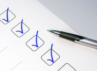 pen and paper with checklist