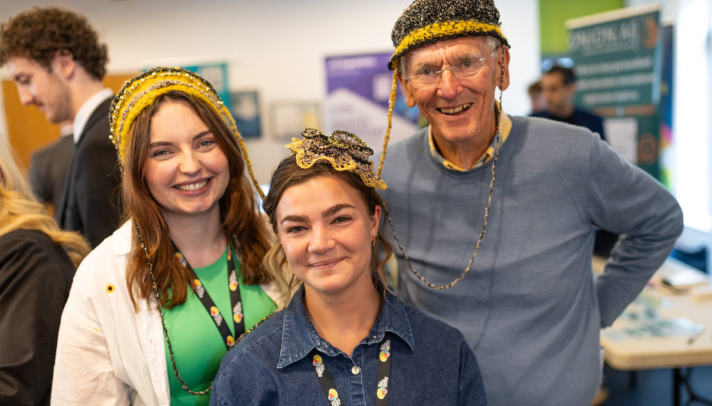 Esme, Bill and Ellie posing rogether in funny hats