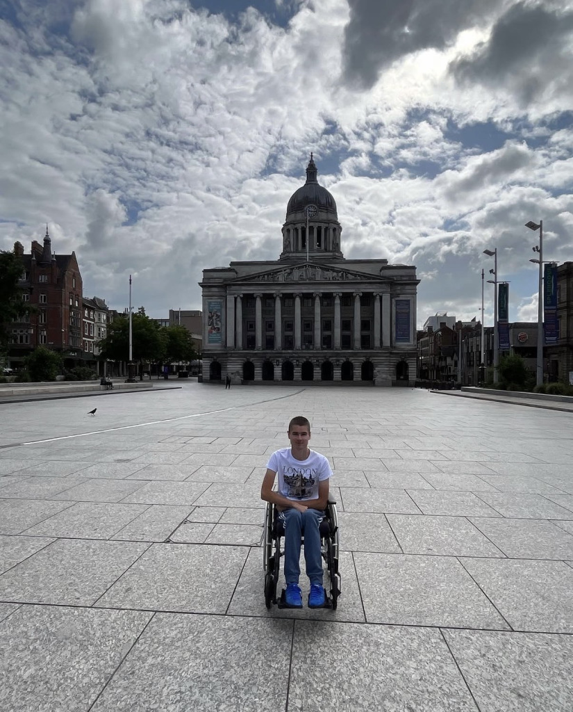 Liam posing for picture in his wheelchair 