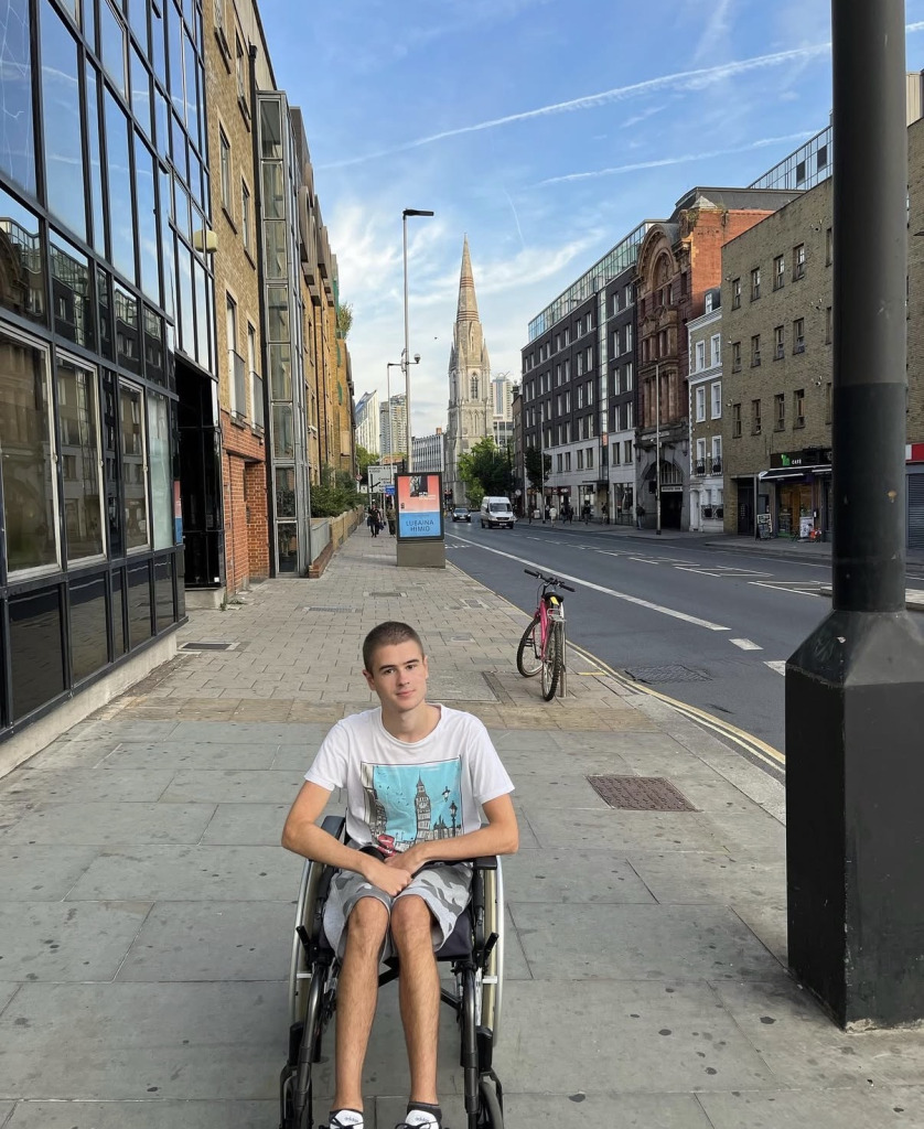 Liam posing for picture in his wheelchair