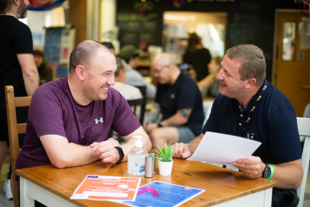 Scott Black and Ste Carson talking in the cafe.