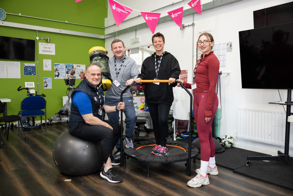 Neuro Gym manager Scott Black posing with our personal trainers in the gym