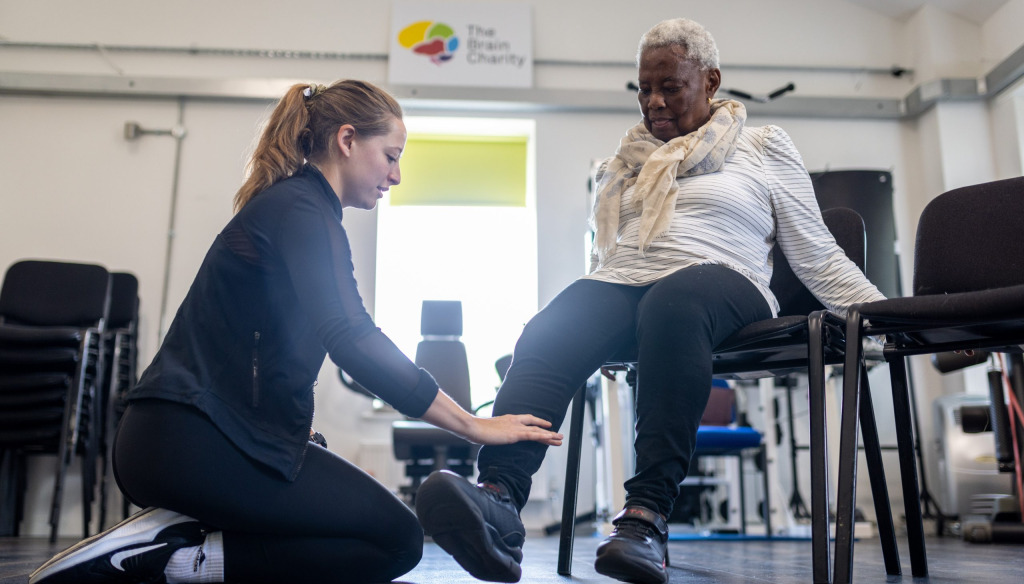 Louisa helping another Neuro Gym client