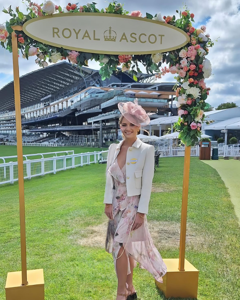 Woman posing for picture at the Royal Ascot.