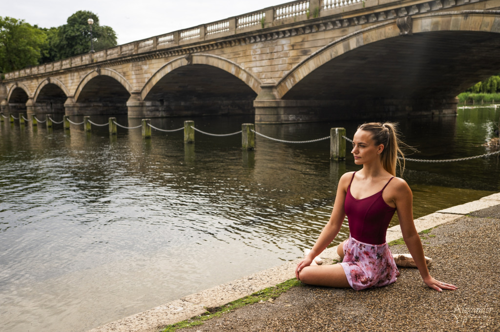 Woman sat beside a river